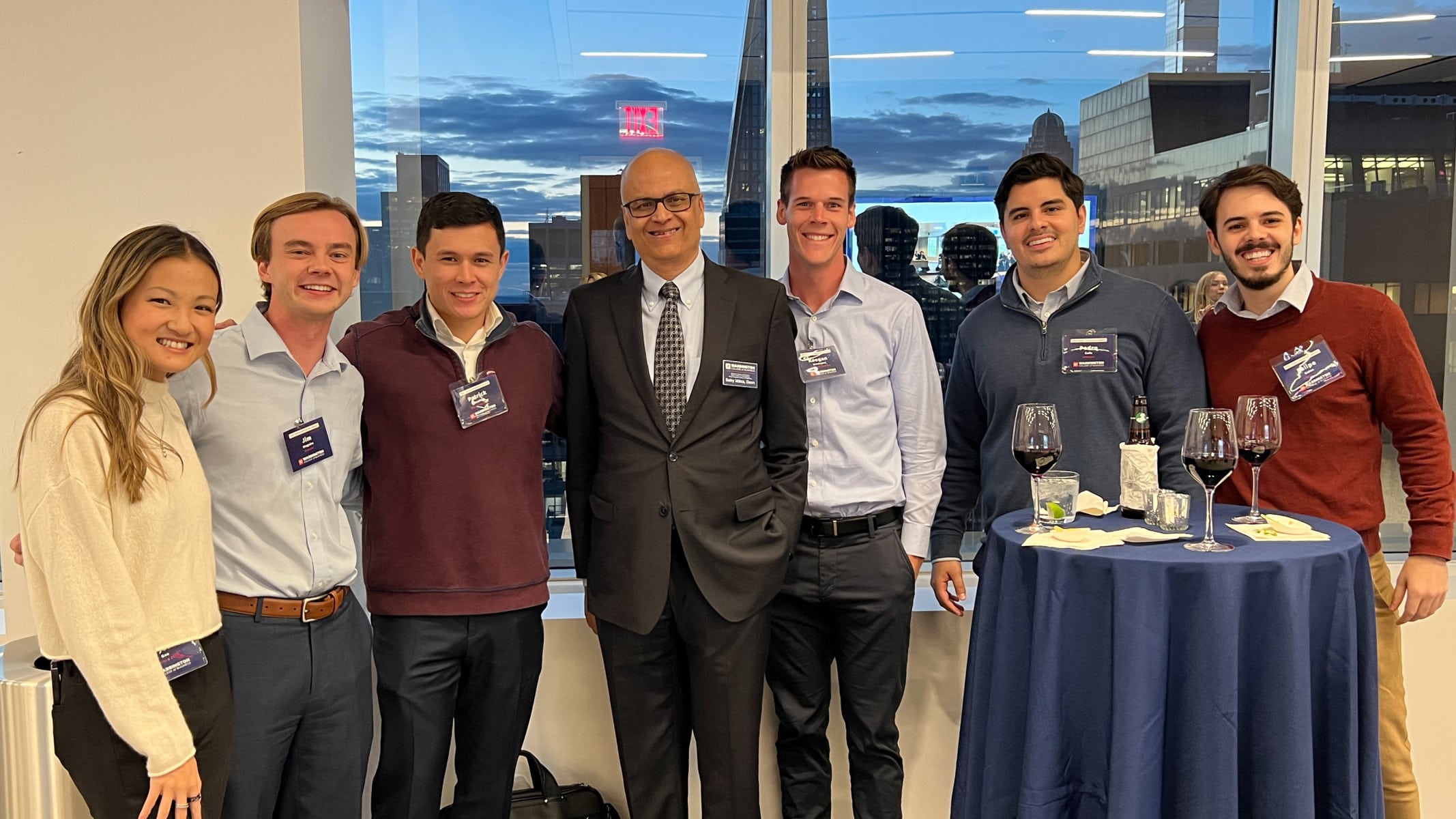 Dean Saby Mitra surrounded by attendees at the 13th Annual NYC Gathering of the Gator Finance Professional