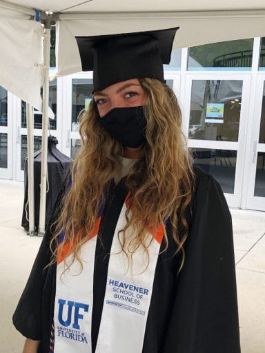 Laura Dominguez graduation photo with a mask on