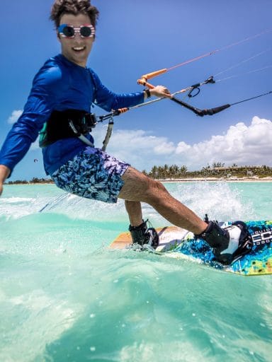 Christian Kechriotis kite surfing on beautiful clear water