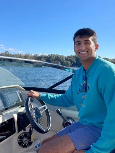 Nicholas Garas at the wheel of a boat