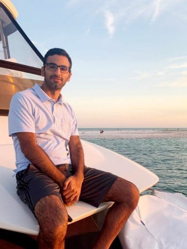 Vinayak Kawatra sits on a boat