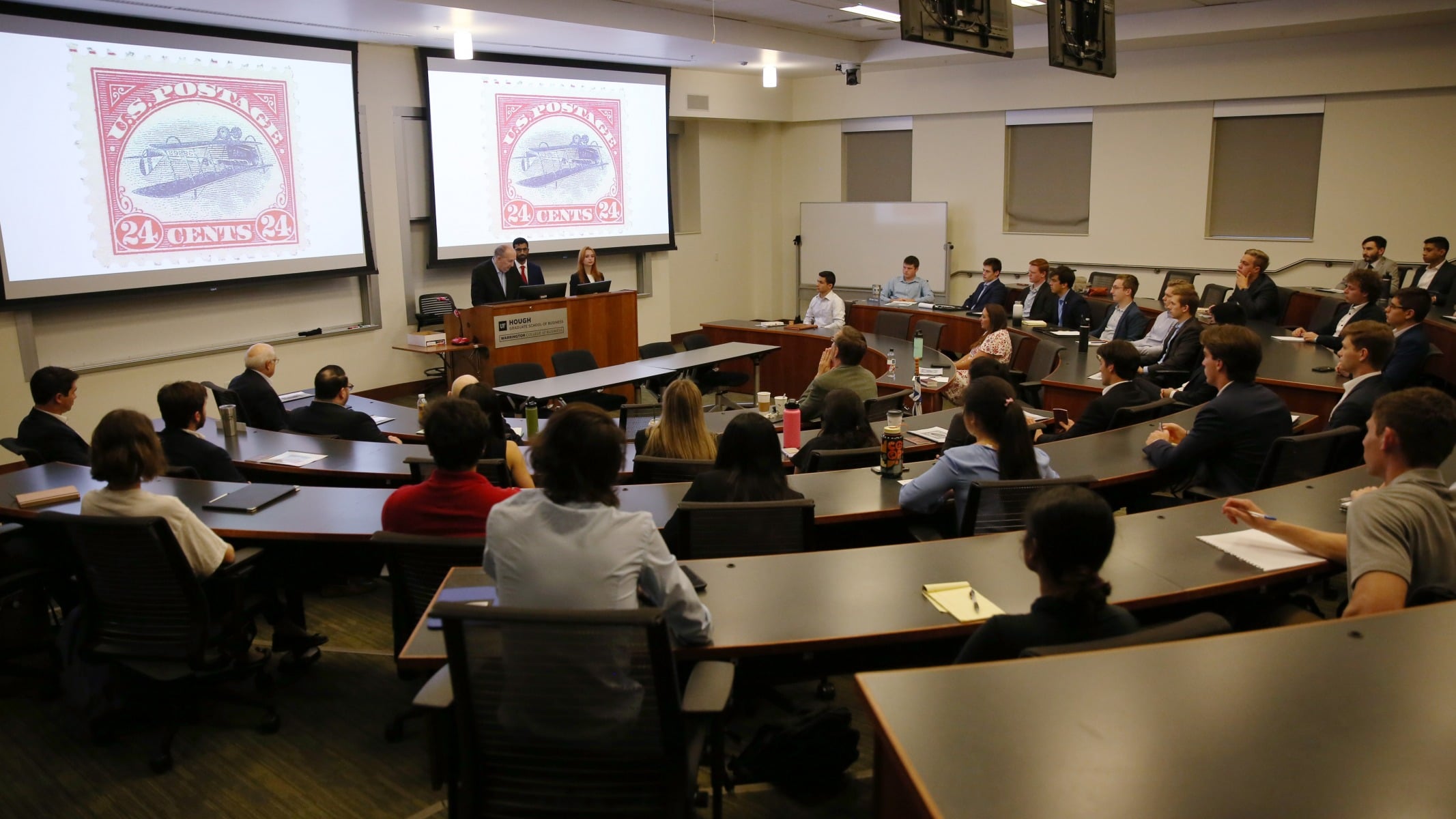 Students attend a panel discussion titled Foundations of Free Enterprise: Capitalism and Capital Markets