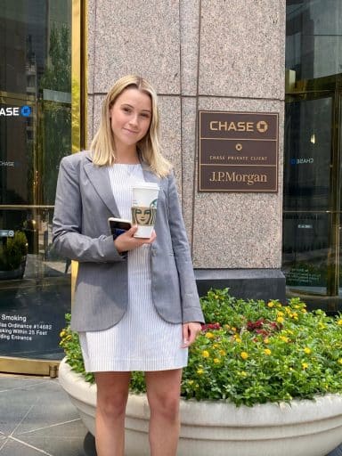 Elise Bell in front of a Chase / J.P.Morgan building