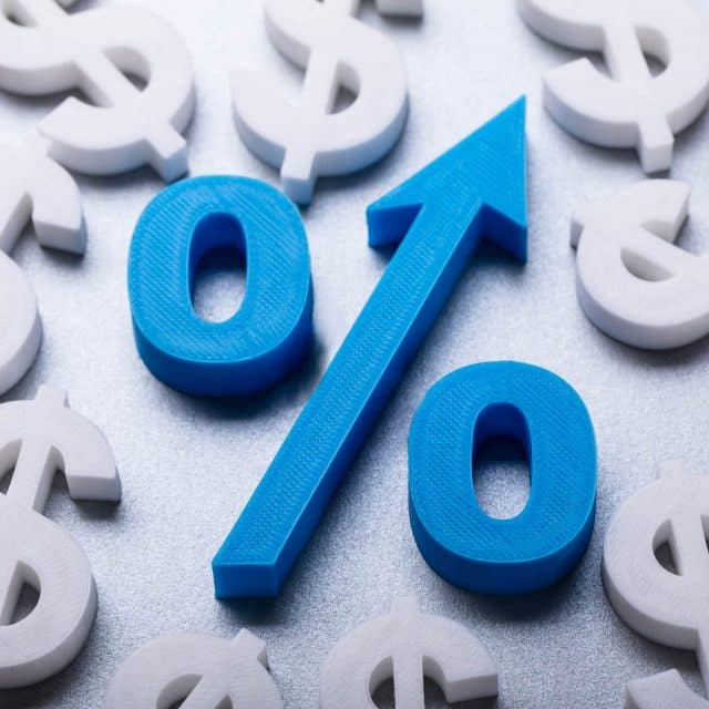 A percent sign with an integrated upward arrow among dollar signs