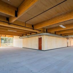 Inside a new construction project using a lot of wood for floors, ceilings and walls