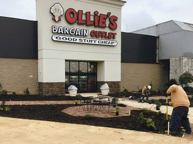 Landscaping crew works outside of Ollie's Bargain Outlet at Marshall Place
