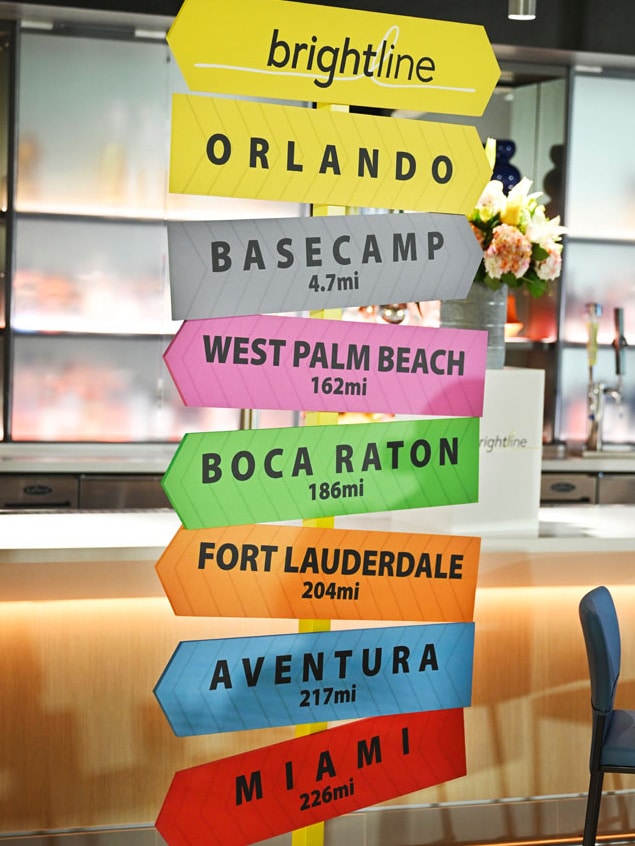Brightline directional signs to Orlando, Basecamp, West Palm Beach, Boca Raton, Fort Lauderdale, Aventura and Miami at the Orlando station