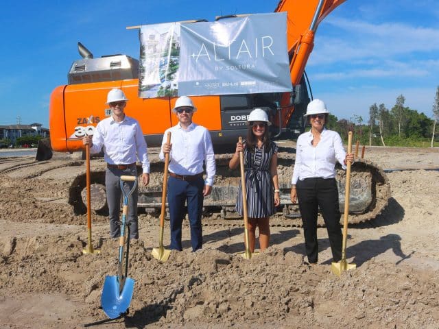Halstatt staff Michael Harris, Peter Michaels and Erin Elferdink with CEO Katie Sproul holding shovels at the groundbreaking for Altair by Soltura in Fort Myers