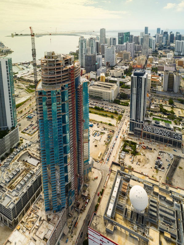 Aerial view of Miami skyscraper construction with other tall buildings in the background
