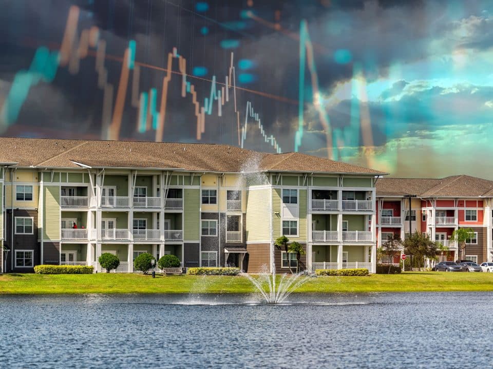 Apartment buildings with a retention pond in the foreground and chart lines overlaid on the sky in the background