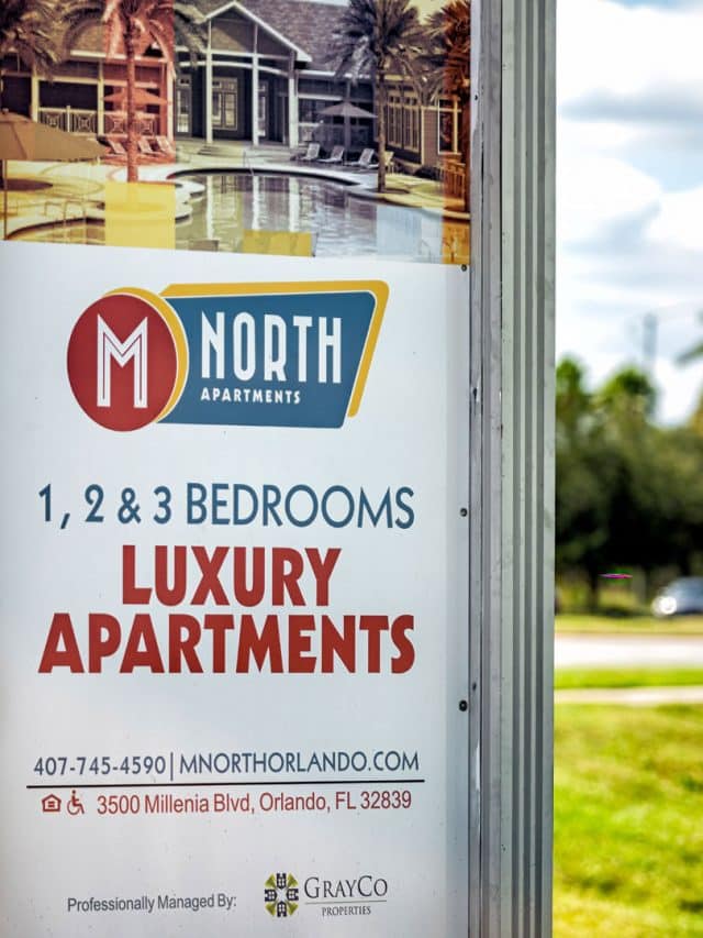 A sign advertising M North Apartments: 1, 2 & 3 bedroom luxury apartments in Orlando, Florida