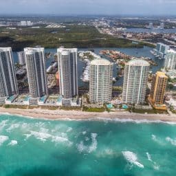 An aerial view of condos lining the coastline