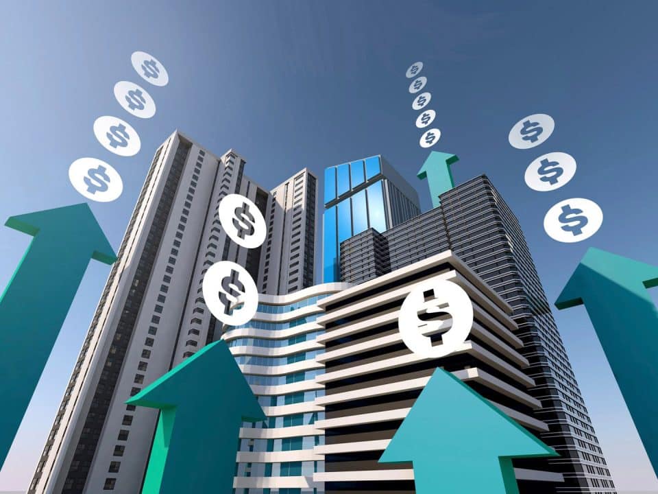 A graphic depicting tall buildings with dollar signs stacked on up arrows