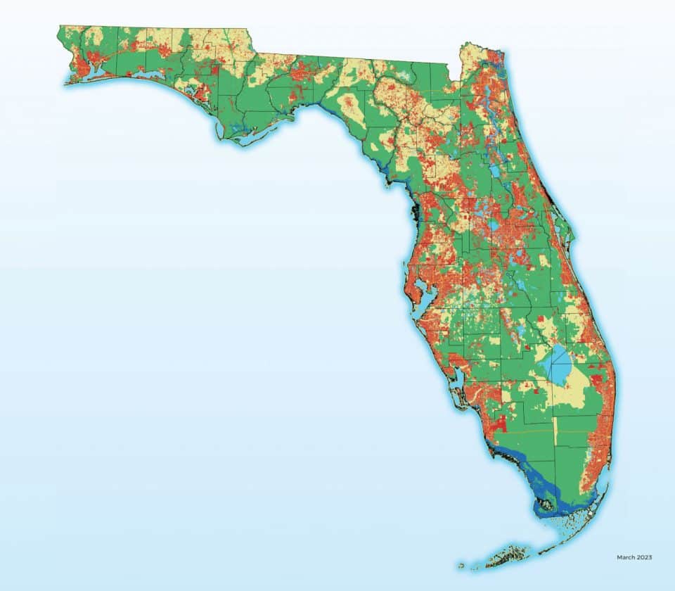 Statewide conservation map visualization of how land use may change in the next two decades: red indicating developed, green indicating protected, blue indicating seal level rise, and yellow indicating other