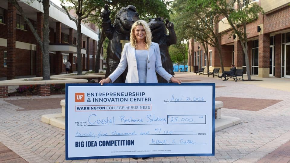 2023 Big Idea Competition Winner: Coastal Resilience Solutions founded by Shelby Thomas who is holding a giant check for $25,000