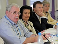 Robert Knechel with others on a panel