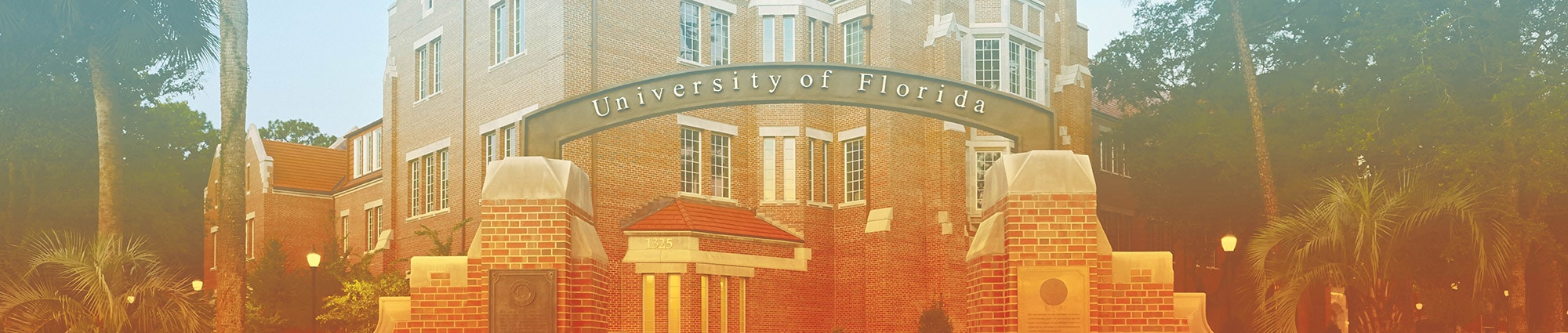 University of Florida gateway with Heavener Hall in the background
