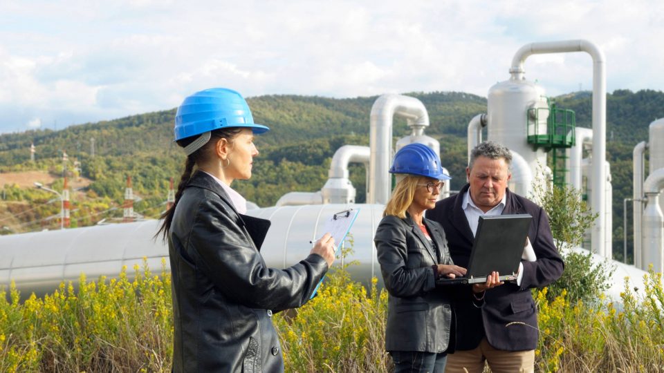 Three engineers planning in a geothermal power station