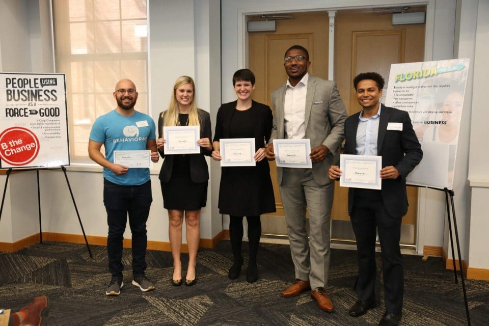UF Business for Good Lab: Sustainable Business Consulting for B Corp certification with Kristin Joys presenting award to BehaviorMe team, founded by Gator Grad, Christian Medina in Spring 2019