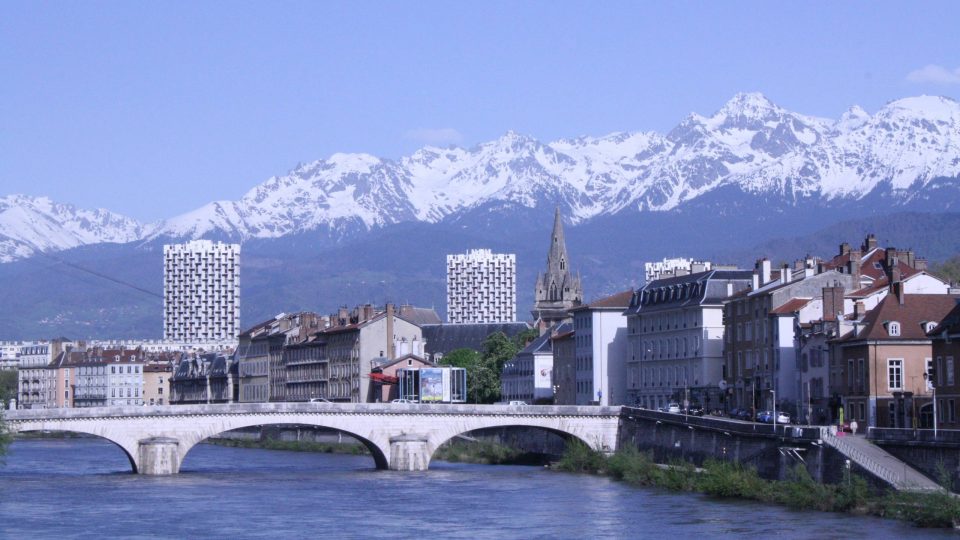 The city of Grenoble with the French Alps in the background