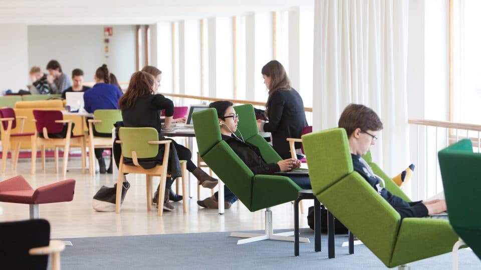 Students using the Aalto University learning hub in Helsinki, Finland