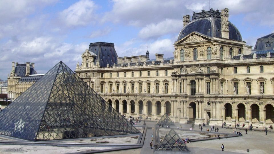 The Louvre Museum and pyramid in Paris, France