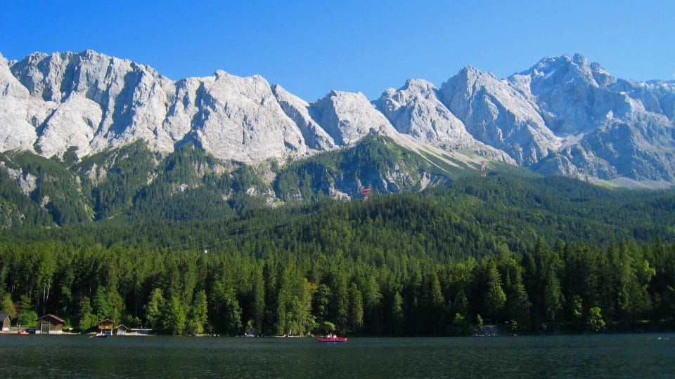 Ebbs lake with evergreen forest and mountains in the background