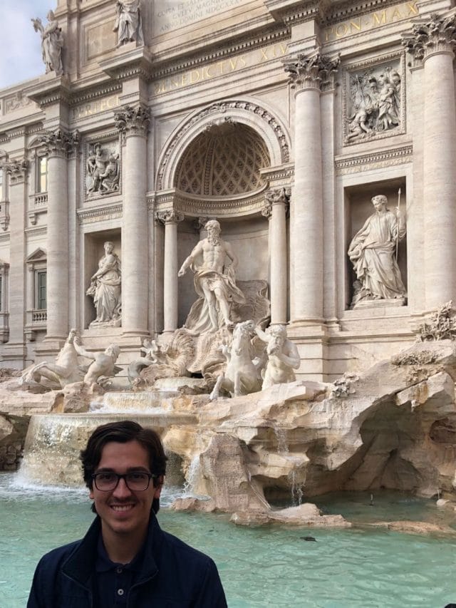Trevi Fountain in Rome, Italy with student in front.