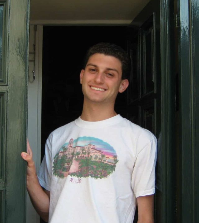 Student, Zachary, in a doorway in Rome.