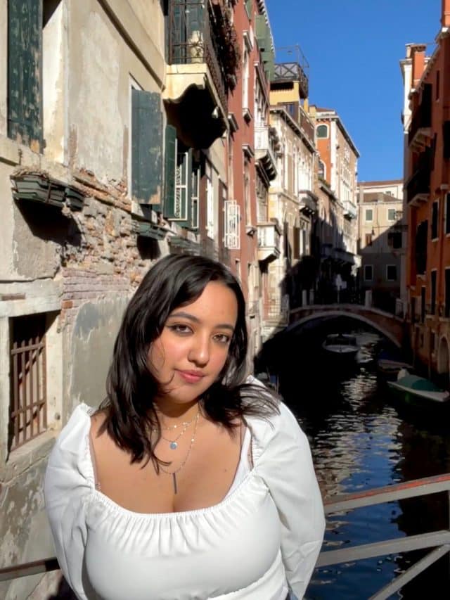 Student, Vianny, in front of a canal in Venice